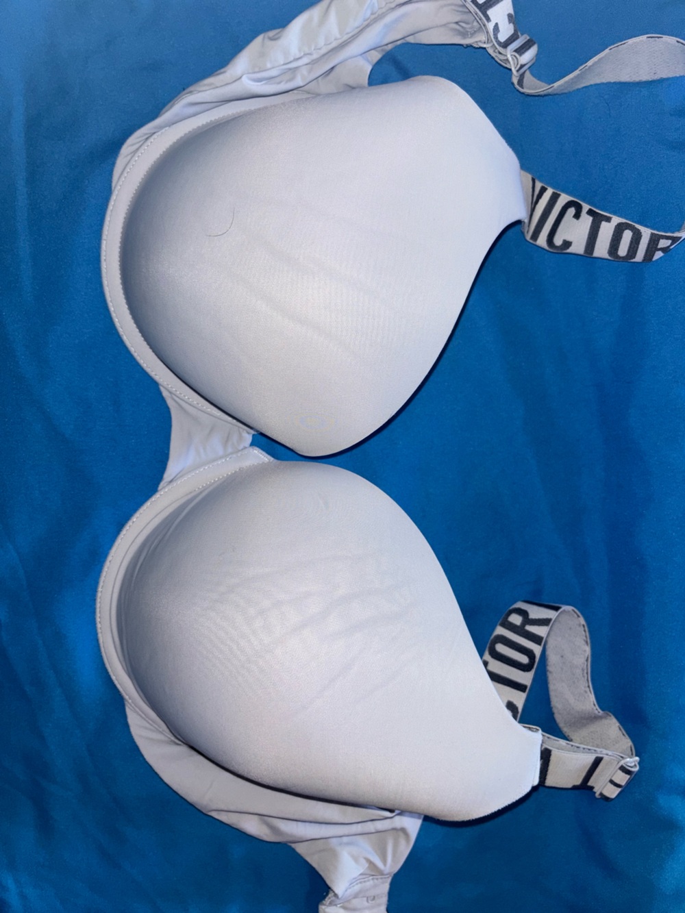 Victoria's Secret Pink Branded Straps on Blue Background